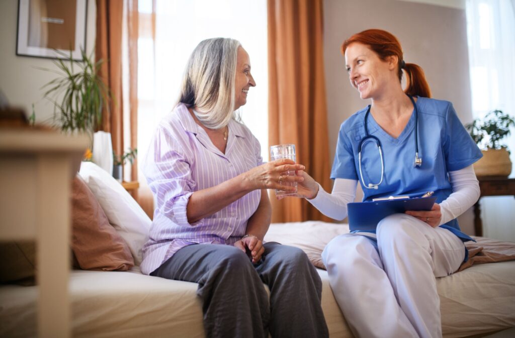 A nurse helps a senior take their morning medication as part of the service offered by assisted living